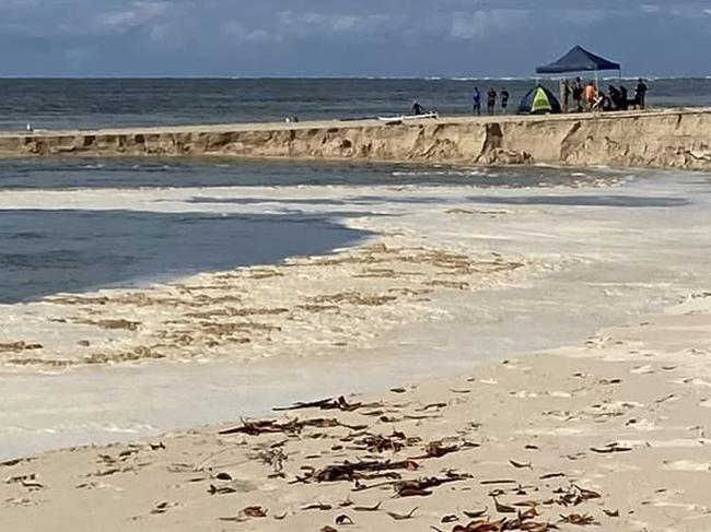 Visitors to Inskip Point have caught a sinkhole opening up on Inskip Point on Anzac Day as hundreds of campers poured into the area for the faux Anzac DayÂ âlong weekendâ.