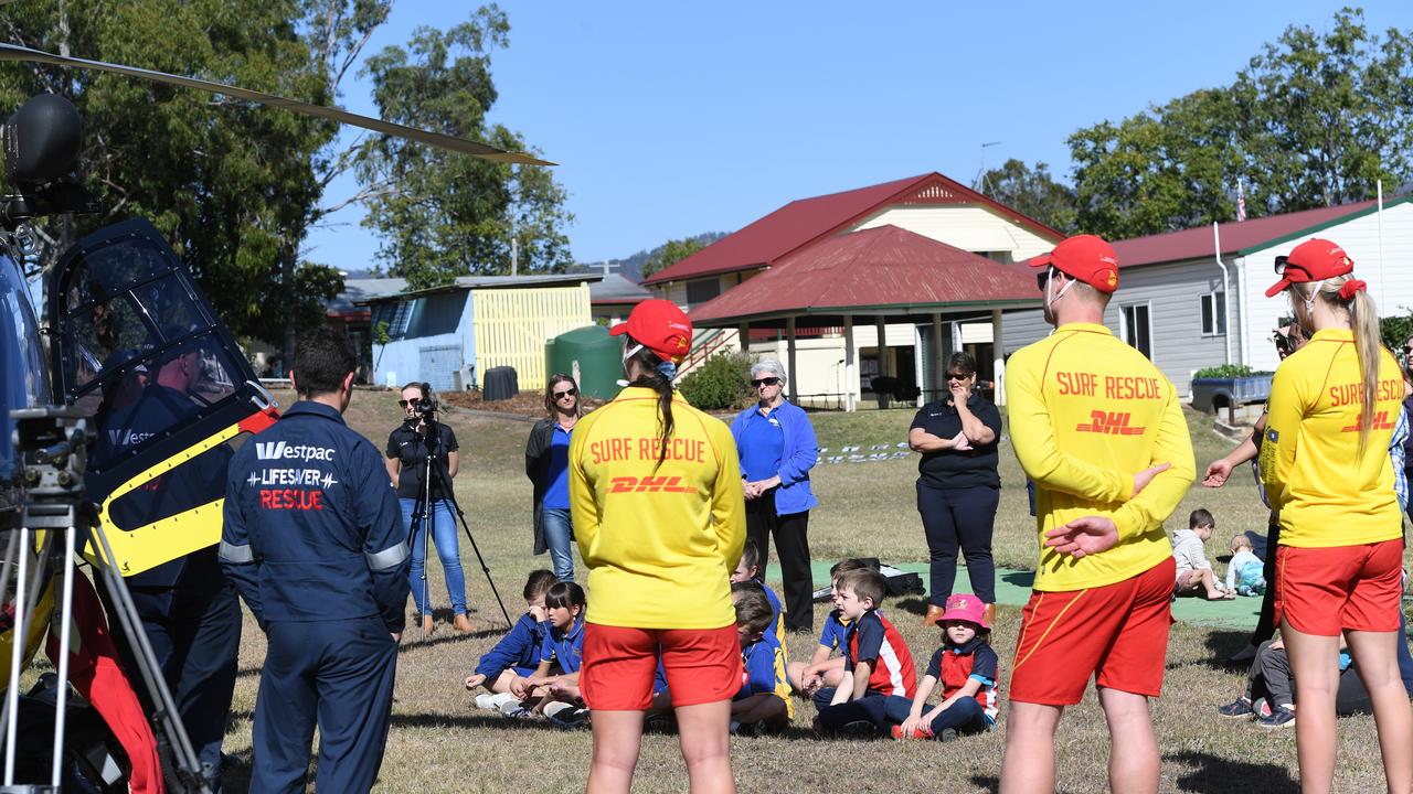 Mount Whitestone State School students check out the Surf Life Saving Queensland Westpac helicopter. PHOTO: ALI KUCHEL