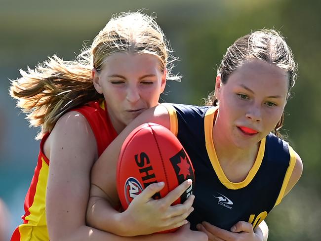 Poppy Tindal of the Lions is tackled by Sunny Lappin during the AFL U16 Girls match between the Brisbane Lions and the Gold Coast Suns on September 19, 2022 in Sunshine Coast, Australia. Picture: Albert Perez/AFL Photos via Getty Images.