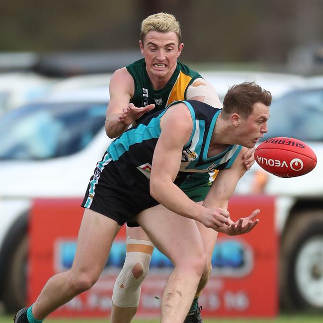 Murchison-Toolamba’s Aidan Lloyd prepares to tackle a Dookie United opponent.