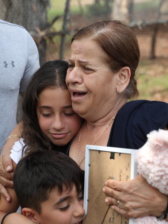 Georgette Abdallah is comforted at Oatlands on Tuesday morning. Pictures: John Grainger