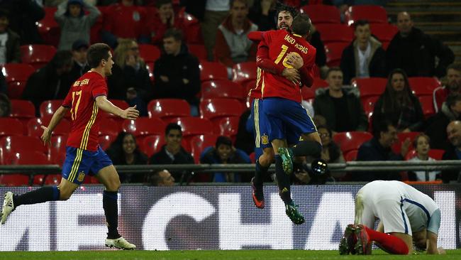 Spain's midfielder Isco (C) celebrates scoring Spain’s second goal.