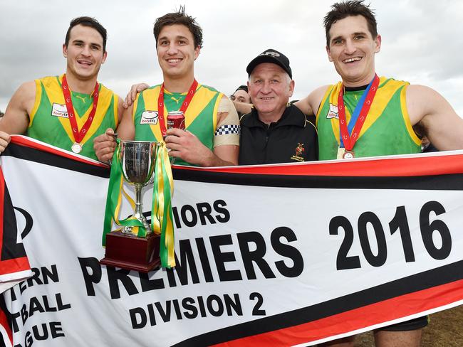 Joel Galvin (right) with father Gary and brothers Mitch and Bryce after the 2016 premiership. Picture: Steve Tanner