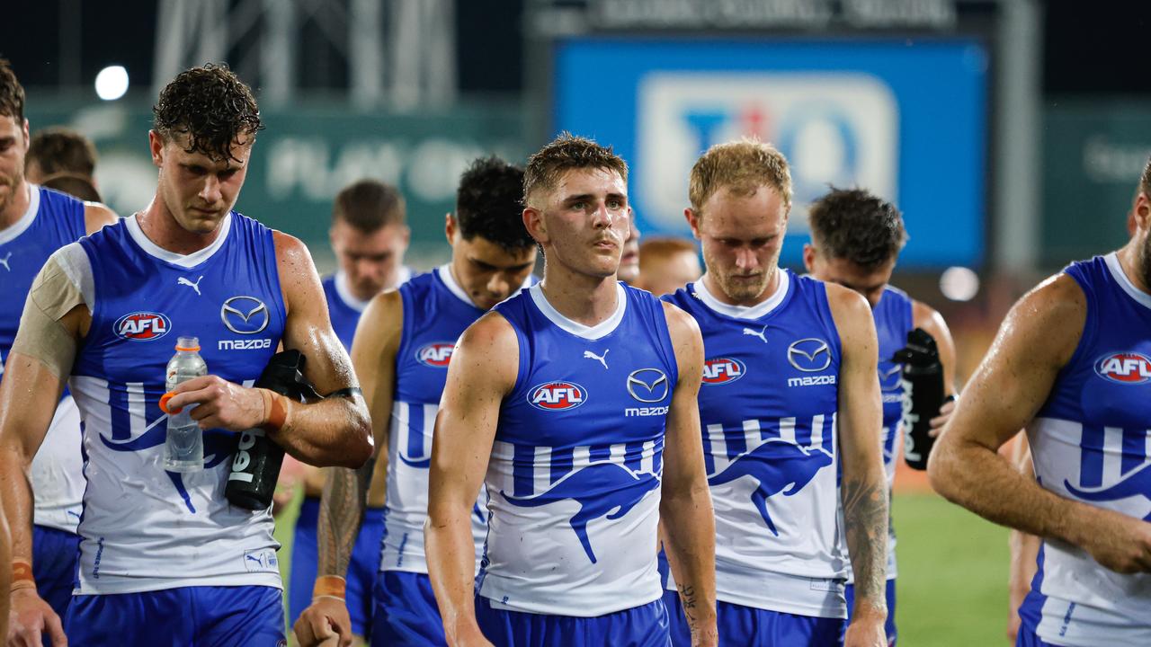 DARWIN, AUSTRALIA - MAY 11: The Kangaroos look dejected as they leave the field after the 2024 AFL Round 09 match between the Gold Coast SUNS and North Melbourne Kangaroos at TIO Stadium on May 11, 2024 in Darwin, Australia. (Photo by Dylan Burns/AFL Photos)