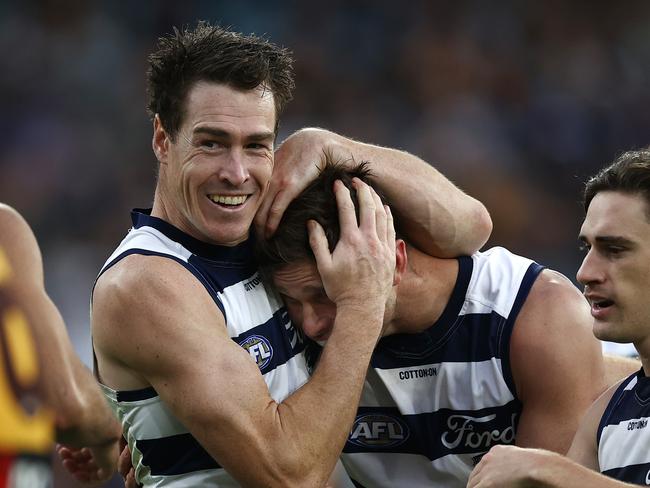 MELBOURNE . 10/04/2023.  AFL . Round 4. Geelong vs Hawthorn at the MCG.  Jeremy Cameron hugs Tom Hawkins after Hawkins gave a handball to Tyson Stengle for an easy goal  . Pic: Michael Klein