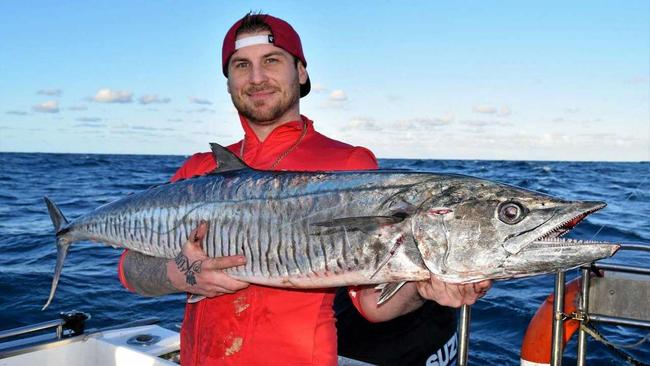 WHAT A CATCH! Jake Day with his "catch of a lifetime" Spanish mackerel that he landed between Rainbow Beach and Fraser Island. Picture: Contributed