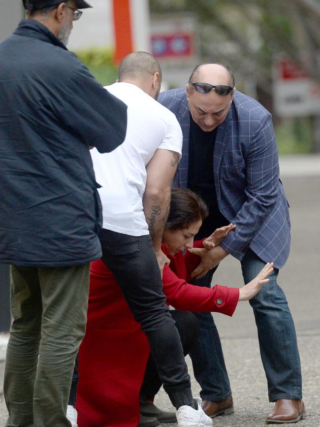 Relatives were overwhelmed with grief outside the crime scene. Picture: Jeremy Piper