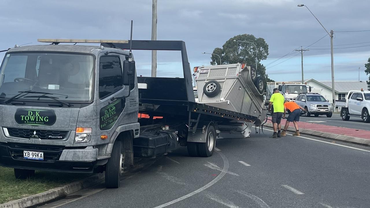 Trailer flips in crash, blocking road for school traffic