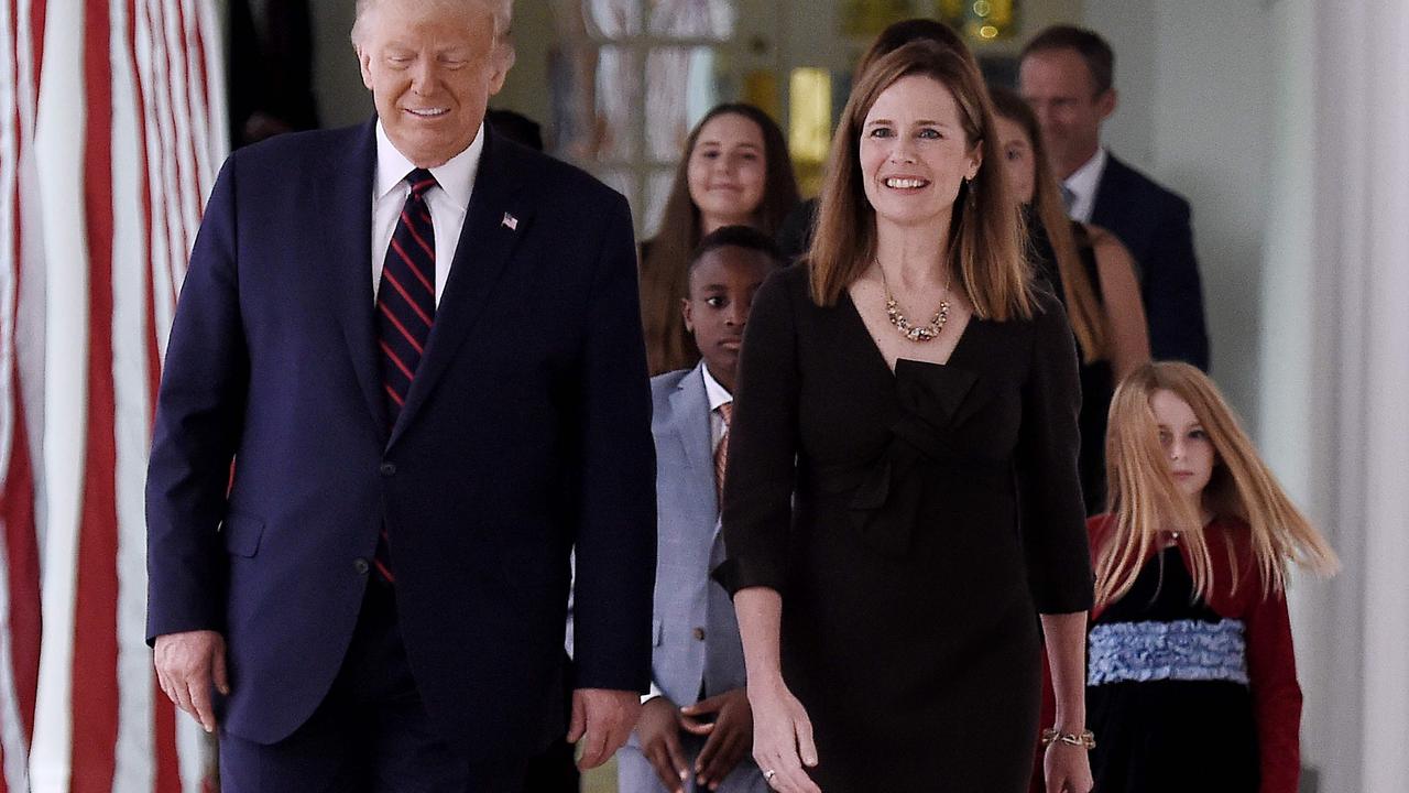 Mr Trump, Judge Barrett, and her family. Picture: Olivier Douliery/AFP