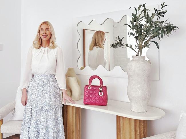 REAL ESTATE: Fashion illustrator Kerrie Hess in the home she is selling in Holland Park. Image supplied.