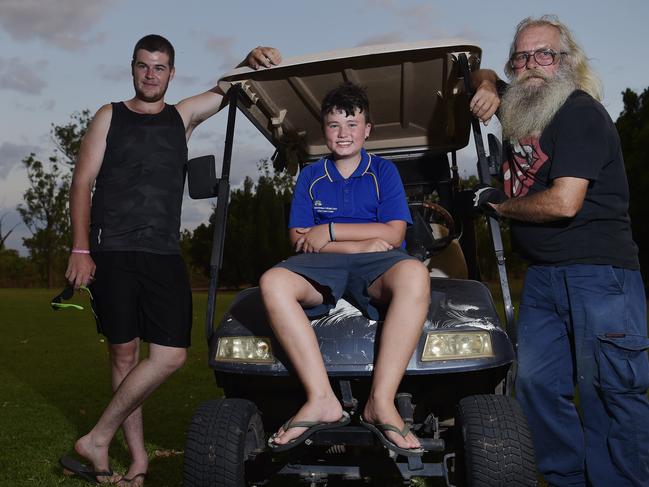 Jabiru locals Reuben Thurbon, Colin Harris and Gedgey sit in a golf buggy at the Jabiru Golf Club on Thursday, November1, 2018 Picture: Keri Megelus