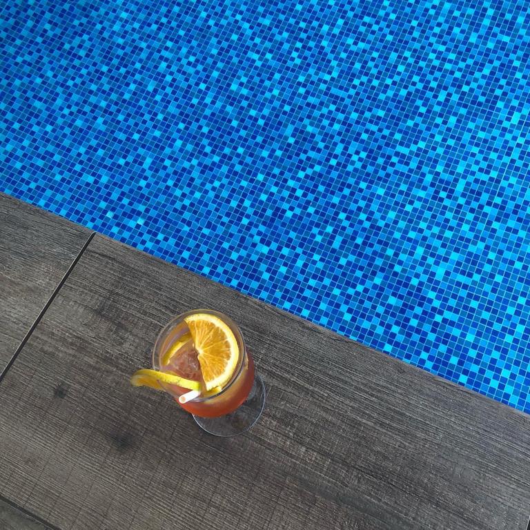 An Aperol Spritz by the Flynn pool – the perfect way to relax on holiday.