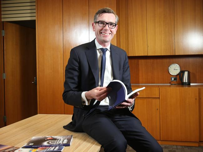 NSW Treasurer Dominic Perrottet with Tuesday’s 2018 Budget information. Picture: Richard Dobson