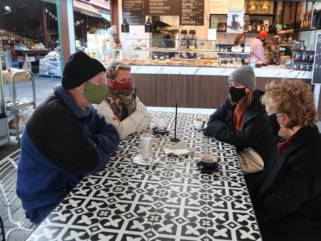 Masks are still compulsory indoor and outdoors. People enjoy a coffee at a city cafe on Friday. Picture: NCA NewsWire / David Crosling