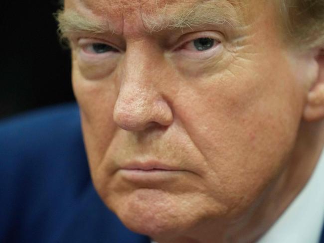 TOPSHOT - Former US President Donald Trump looks on in the courtroom, during his trial for allegedly covering up hush money payments linked to extramarital affairs, in New York City, on April 29, 2024. Trump, 77, is accused of falsifying business records to reimburse his lawyer, Michael Cohen, for a $130,000 hush money payment made to porn star Stormy Daniels just days ahead of the 2016 election against Hillary Clinton. (Photo by Seth Wenig / POOL / AFP)