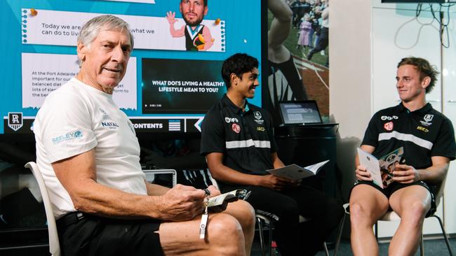 Port legend Russell Ebert with players Trent Burgoyne and Jackson Mead. Picture: AAP / Morgan Sette