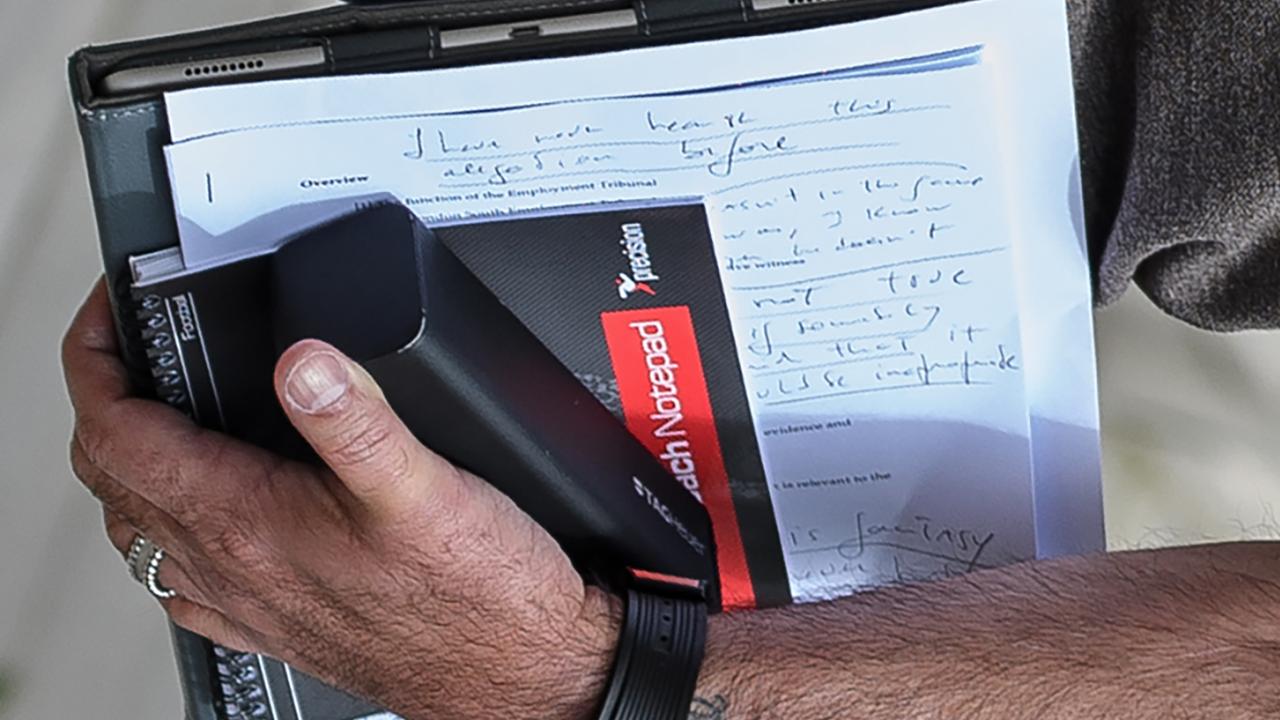 Portuguese football manager Jose Mourinho is pictured carrying written notes as he returns to his home in London on May 24, 2016. Mourinho is on the verge of fulfilling his dream of managing Manchester United after Louis van Gaal's troubled two-year reign at Old Trafford came to a bitter end. Van Gaal said he was "very disappointed" to be sacked on May 23, just 48 hours after leading United to victory in the FA Cup final against Crystal Palace. / AFP PHOTO / LEON NEAL