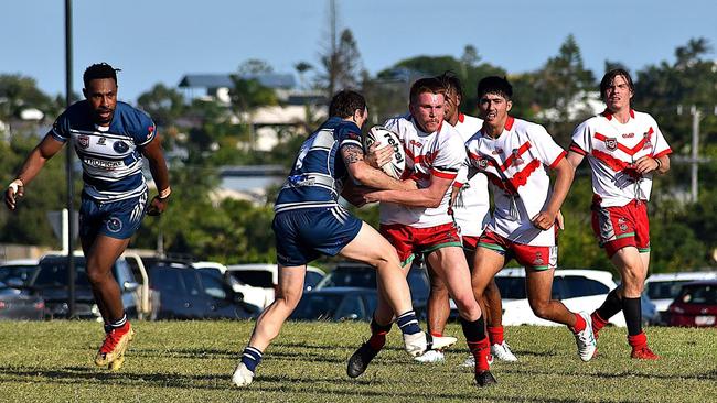 Emu Park halfback Travis Field on the attack, with teammates Jake Lawton and Connor Rothery in support. Photo: George Vartabedian