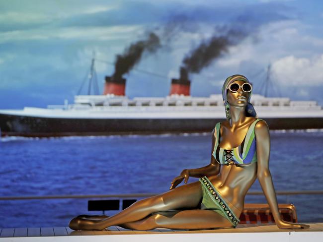 A mannequin displays an Emilio Pucci bikini from about 1968 made for Saks Fifth Avenue, as part of a bathing suit installation featuring the backdrop of an ocean liner moving across a screen during a media preview of the 