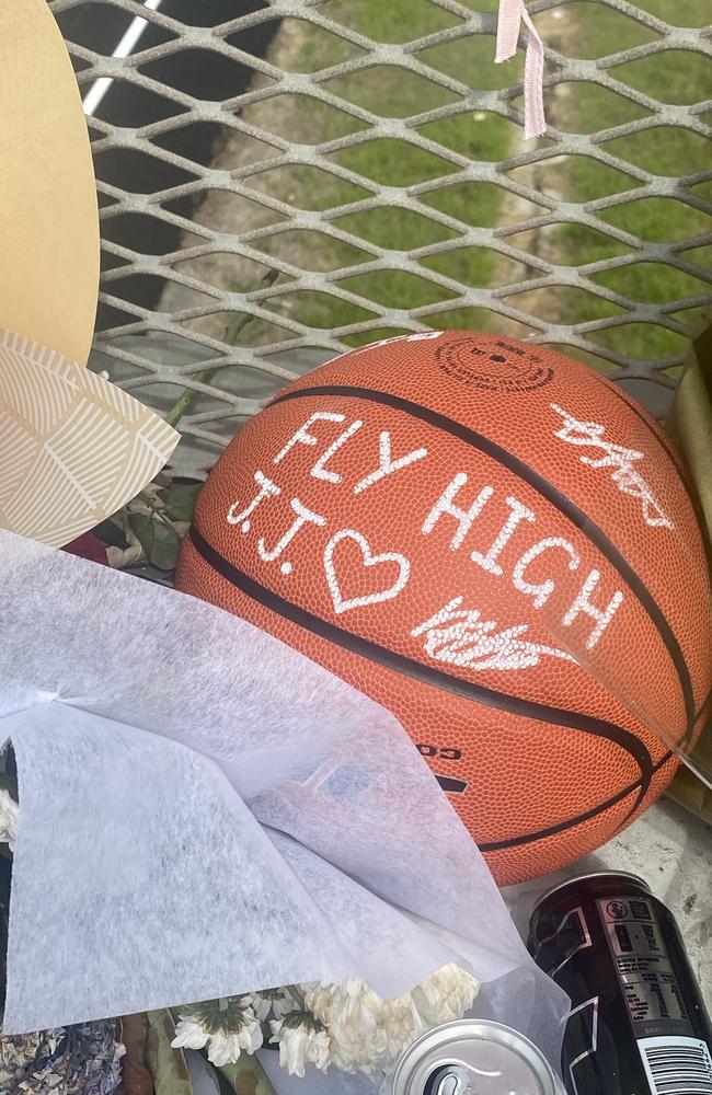 A basketball stating “fly high JJ” has appeared at the site of a tragic incident in Maroochydore last week. Picture: Elizabeth Neil