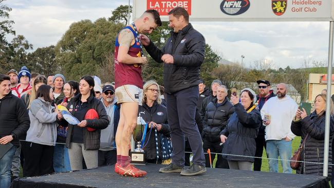 James Hewson is presented with the grand final medal. Picture: Ben Higgins