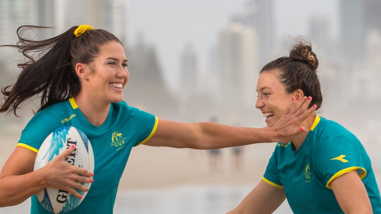 Charlotte Caslick and Emilee Cherry of the Australian Women's Sevens team on Nobby's Beach, Gold Coast, ahead of the 2018 Commonwealth Games. Photo: RUGBY.com.au/Stuart Walmsley