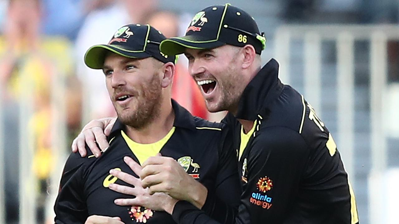 Aaron Finch of Australia celebrates taking a catch from the bowling of Kane Richardson of Australia to dismiss Shadab Khan.