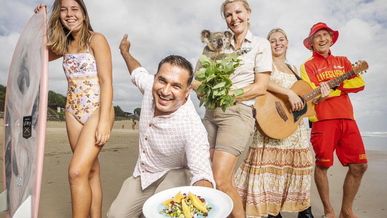 Surfer Mia Waite, Chef Peter Kuruvita, Wildlife HQ keeper Suzanne Pearson with Mango the Koala, performer Sari Abbott and lifeguard Billy Moore are excited to welcome visitors to Queensland as the state borders finally reopen. Picture Lachie Millard