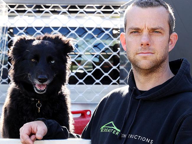 SUNDAY TELEGRAPH - Pictured in Newport today is Builder Braden Carter from Crearter Constructions with his dog Nala, whose business will be affected by the new lockdown restrictions on construction coming into effect on Monday. Picture: Tim Hunter.