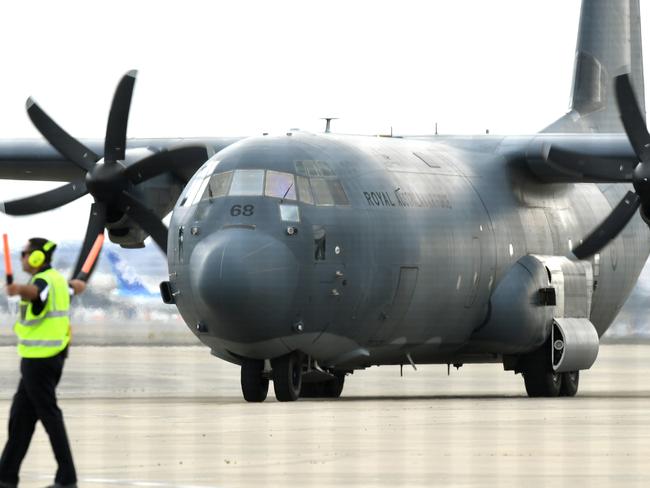 A C-130 Hercules arrives with survivors of the fatal volcanic eruption at Sydney Airport. Picture: AAP