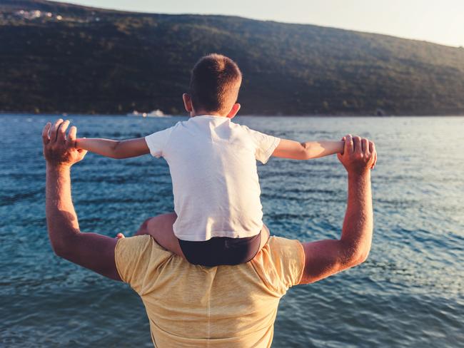 Father and son on sunset beach. Dad and son playing together outdoors on a summer beach.Photo: iStockESCAPE, NEWS3 SEPTEMBER 2023Print use onlyEscape use only