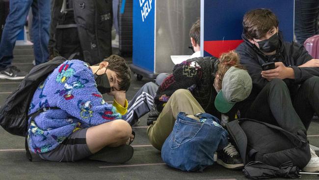 Travellers wait in line to check in at Los Angeles International Airport on December 23. Over 2000 flights have been cancelled and thousands delayed around the world as the highly infectious Omicron variant disrupts holiday travel. Picture: AFP