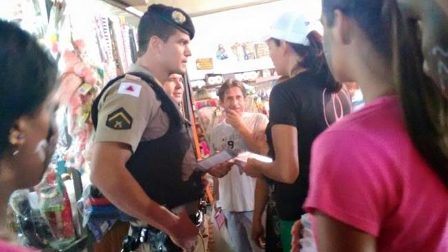 A police officer talks with staff from the Pink House which regularly reports child sex exploitation of young girls in Brazil. Picture: Meninadanca