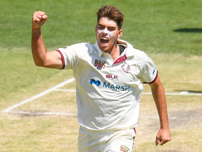 Xavier Bartlett celebrates the wicket of Tom Cooper in Queensland’s Sheffield Shield win over South Australia. Picture: AAP Image/Albert Perez