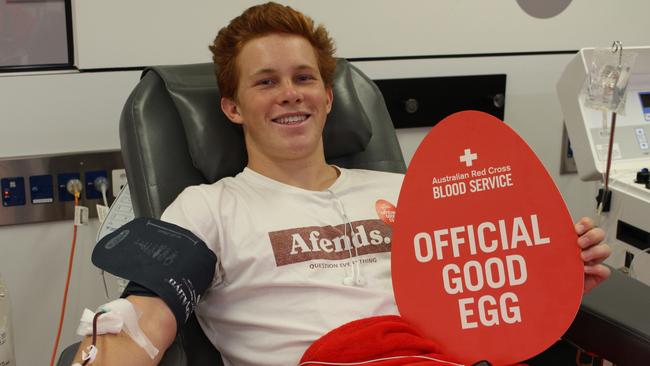 Max Cridland donating blood for Red Cross.