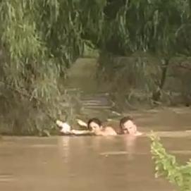 Three people, including a teenage girl and a hero cop were rescued from floodwaters in Dalby. Picture: Anthony Gerard