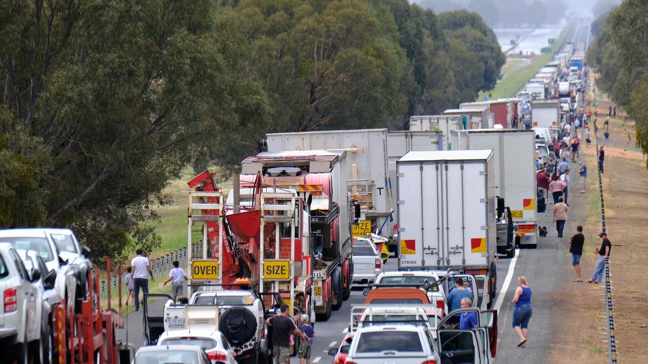 People stranded on the Hume Freeway near Wangaratta after the road was closed due to flooding. Picture Simon Dallinger