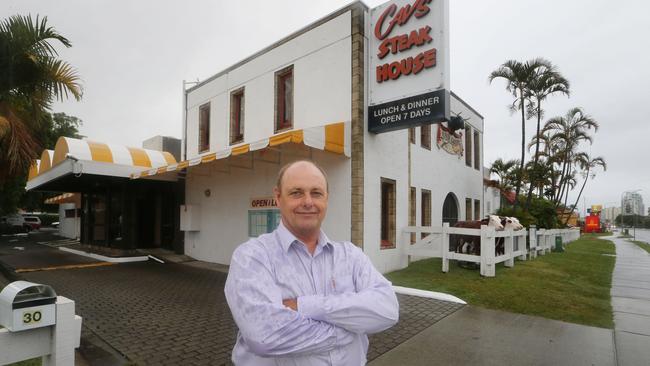 Richard Cavill and his famous cows outside Cav's Steakhouse. The longtime owner and great-grandson of Jim Cavill is talking about the future of the site at Labrador. Picture Glenn Hampson