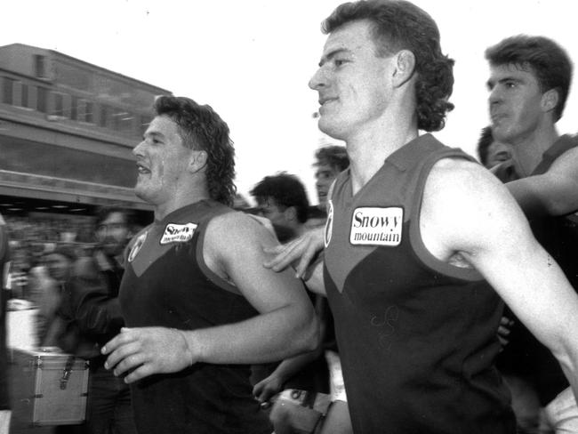 Allen Jakovich and Demons Steven Stretch and Jim Stynes leave Victoria Park after winning in 1992.