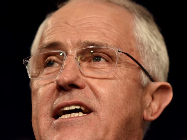 Australian Prime Minister Malcolm Turnbull speaks to the party faithful at aA Liberal Party election night event in Sydney on July 3, 2016. Australia's election was on a knife-edge with the ruling conservatives struggling to win enough seats to form majority government, raising the prospect of a hung parliament. / AFP PHOTO / POOL / LUKAS COCH