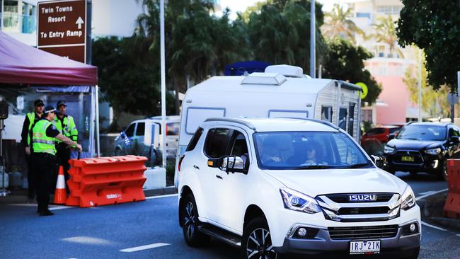 Queensland Police stop and turn Victorian vehicles around for a secondary check at the Griffith Street Coolangatta Border Checkpoint Picture Scott Powick