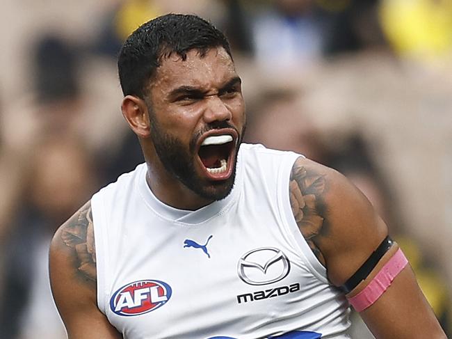 MELBOURNE, AUSTRALIA - AUGUST 19: Tarryn Thomas of the Kangaroos celebrates kicking a goal during the round 23 AFL match between Richmond Tigers and North Melbourne Kangaroos at Melbourne Cricket Ground, on August 19, 2023, in Melbourne, Australia. (Photo by Daniel Pockett/Getty Images)