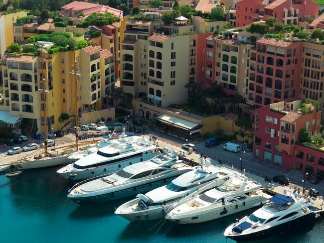 Scenic view of boats and luxury yachts moored in Fontvielle harbour and marina of Monte Carlo, Monaco, South of France.