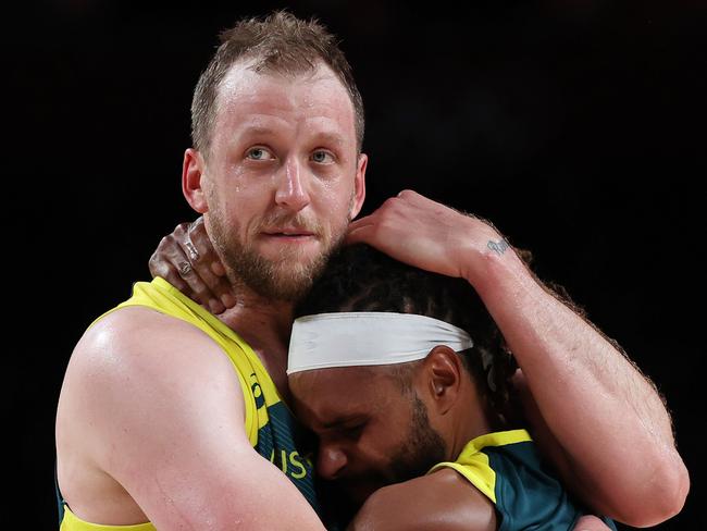 Patty Mills and Joe Ingles celebrate Australia’s historic bronze medal at the Tokyo Olympics. Picture: Kevin C. Cox/Getty Images