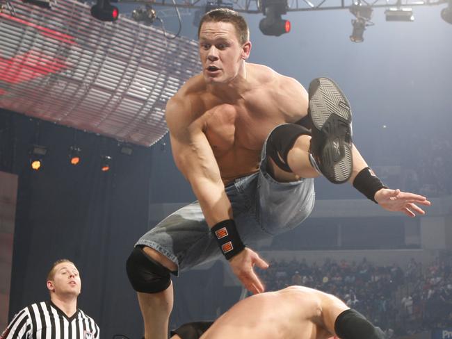 Wrestling champ John Cena in action in the ring.