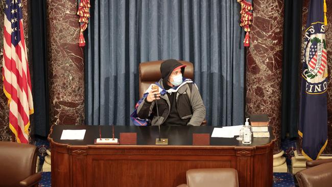 A protester sits in the Senate Chamber. Picture: Getty Images