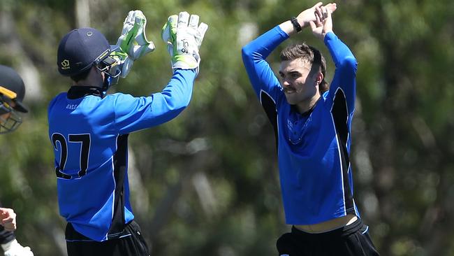 Jacob Pawlowicz celebrates a wicket with Nick Dixon. Picture: Hamish Blair