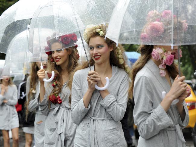 Pink roses + red lips = SS19s expert beauty vibes. Picture: AP Photo/Diane Bondareff