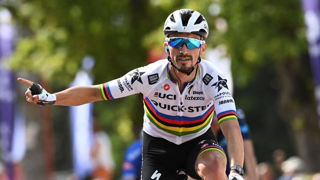 (FILES) In this file photo taken in Huy on July 23, 2022 shows French cyclist Julian Alaphilippe celebrating as he crosses the finish line to win the first stage of the Tour De Wallonie cycling race. - Title holder Alaphilippe will spearhead the French team at the road cycling world championships in Australia, French team manager Thomas Voeckler announced on September 13, 2022. (Photo by JOHN THYS / BELGA / AFP) / Belgium OUT