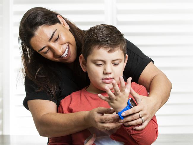 Kathrine Peereboom has two smartwatches she gives to her son Oliver, 7, to keep him occupied, calm, and on schedule. Picture: Nigel Hallett